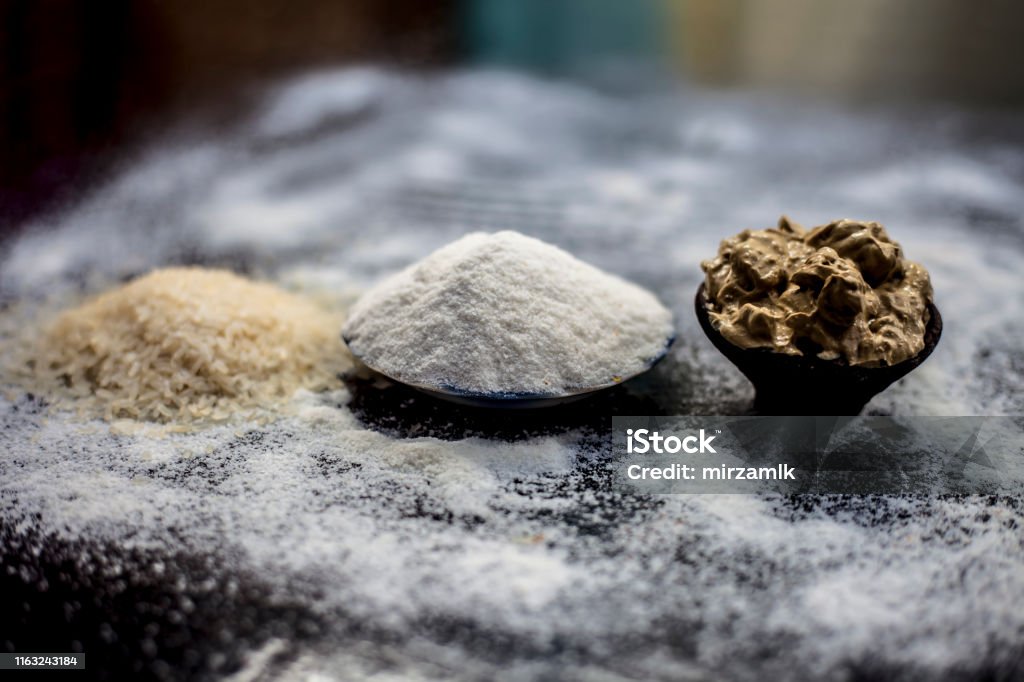 Remedy For Smooth Hair On Wooden Surface Consisting Of Rice Flour And Rice  Grains Well Mixed With Mulpani Mitti Or Multani Mitti Stock Photo -  Download Image Now - iStock