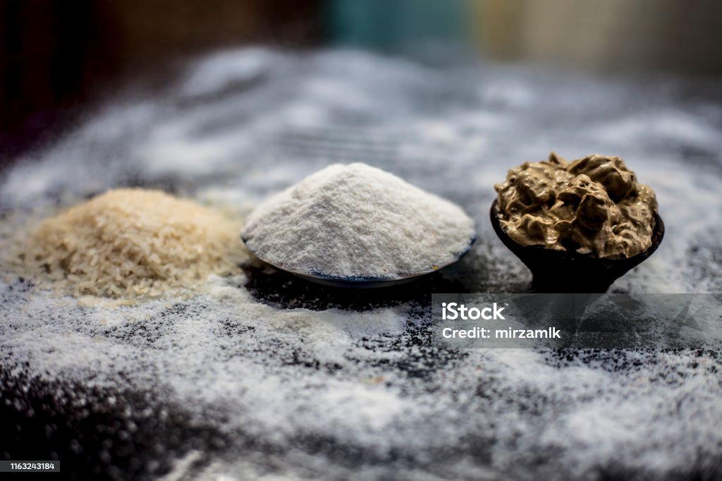 Remedy For Smooth Hair On Wooden Surface Consisting Of Rice Flour And Rice Grains Well Mixed With Mulpani Mitti Or Multani Mitti Stock Photo - Download Image Now - iStock Remedy For Smooth Hair On Wooden Surface Consisting Of Rice Flour And Rice Grains Well Mixed With Mulpani Mitti Or Multani Mitti Stock Photo - Download Image Now - iStock