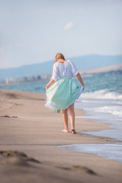 istock Girl  fun on the beach 1163243206