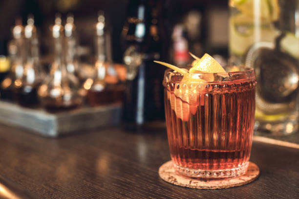 istock Cocktail isolated on bar counter side view 1163243520