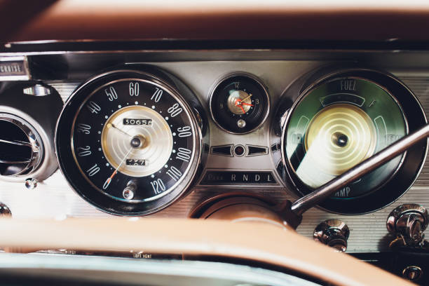 istock Vintage car dashboard with chrome rims speedometer tachometer. 1163243538
