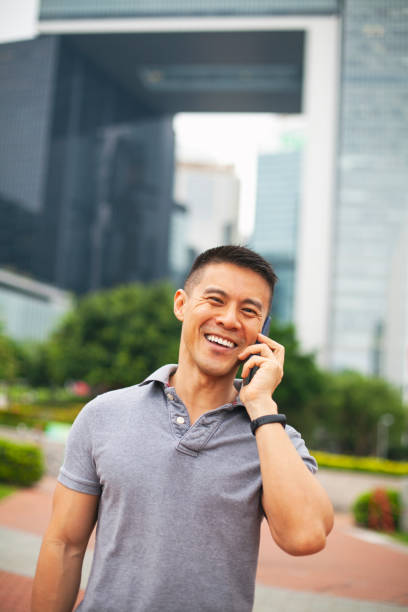 istock Asian man outdoors on the phone 1163245329