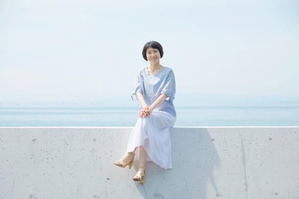 Japanese woman in the summer Japanese woman in the summer groyne stock pictures, royalty-free photos & images