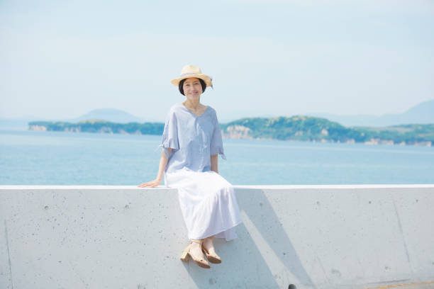 Japanese woman in the summer Japanese woman in the summer groyne stock pictures, royalty-free photos & images