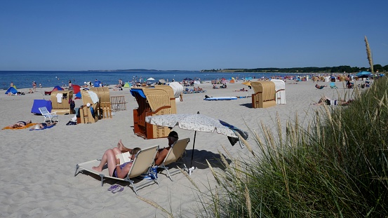 Holidays by the sea,\non the Baltic Sea coast on the long, sandy beach of the Hohwacht Bay.\nSehlendorf / Blekendorf, Schleswig-Holstein, Germany, Europe - June 26, 2019: