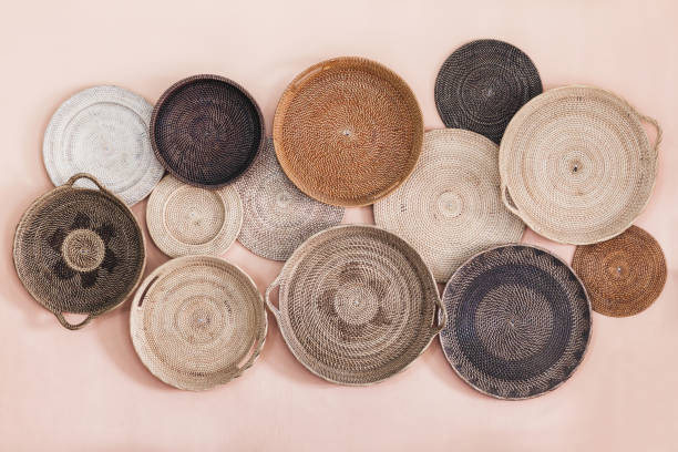 istock Wall decorated with different wicker handmade trays and baskets. Eco style and concept, Moroccan culture. 1163252391