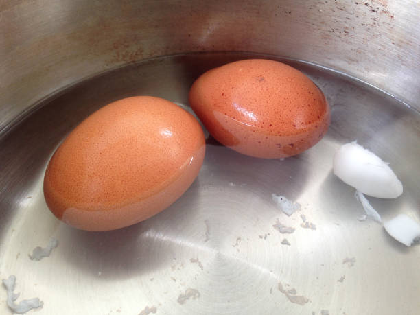 istock Soft-boiled eggs in the stainless pot. Two eggs placed in the pot. 1163254394