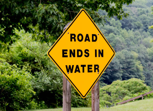 istock road ends in water sign 1163261611
