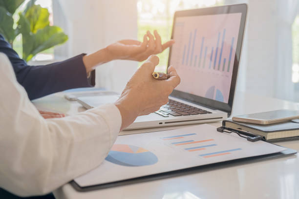 istock Business team brainstorming and discussing with financial data and report graph. Teamwork meeting working concept. 1163267653