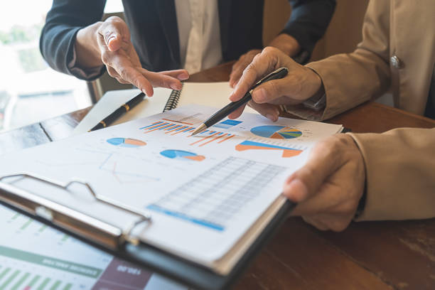 istock Business team brainstorming and discussing with financial data and report graph. Teamwork meeting working concept. 1163267687