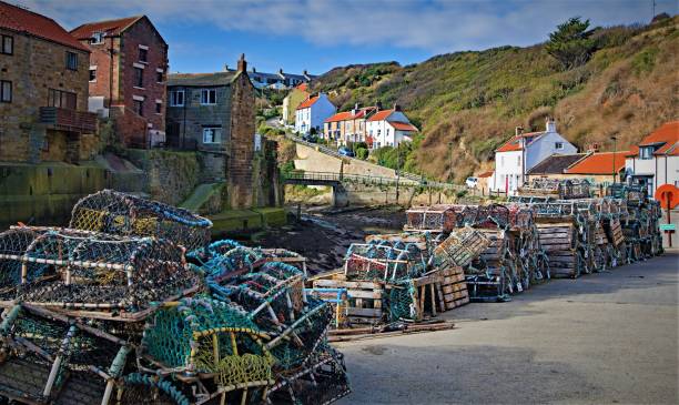 Lobster pots trail in Staithes, Scarborough, North Yorkshire, England stock photo