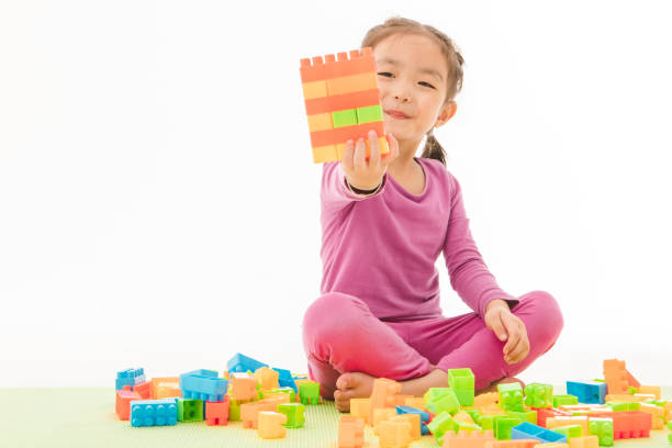 istock Little girl playing 1163273452