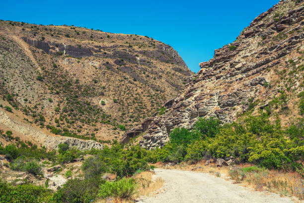 istock Dirt road in the mountains area 1163273833