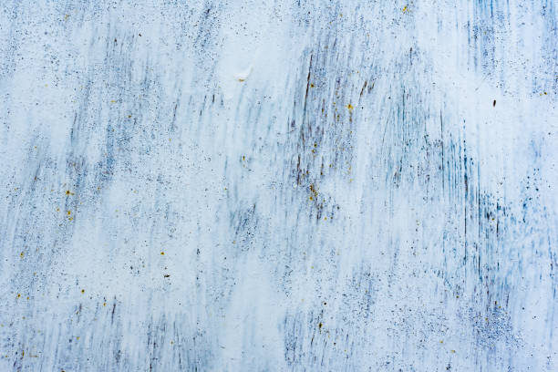 istock Texture of a concrete wall with cracks and scratches which can be used as a background 1163274471