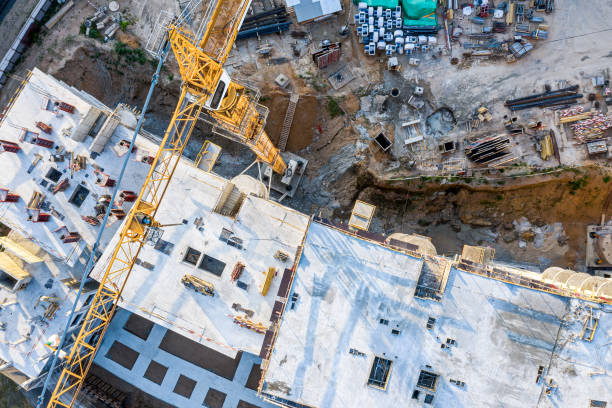 istock top view of high yellow tower crane working at construction site 1163277770