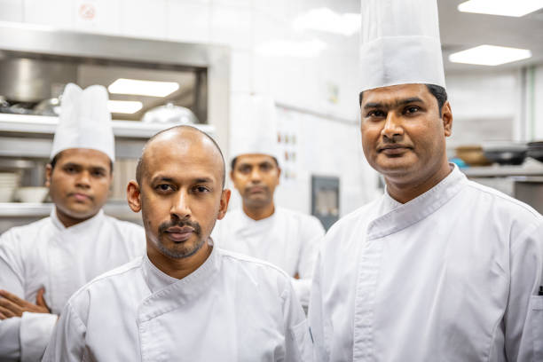 istock Chefs posing in a professional kitchen of a gourmet restaurant 1163284737