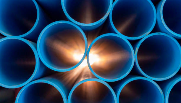 istock Group of blue water pipes That is stacked into a graphic format With light coming from behind 1163285886