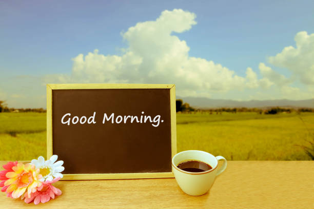 istock blackboard and coffee on blur paddy field in cloudy day 1163287766