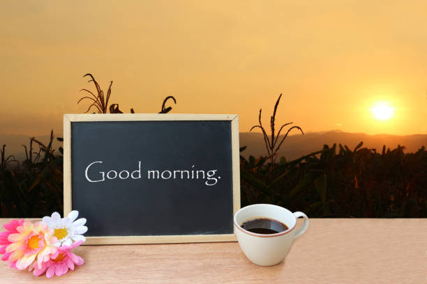 istock blackboard and coffee on meadow in sunrise background 1163287787