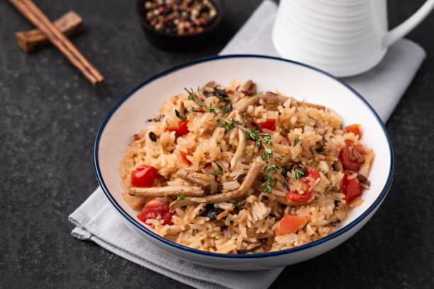 istock fried rice with tomato and mushroom 1163289367