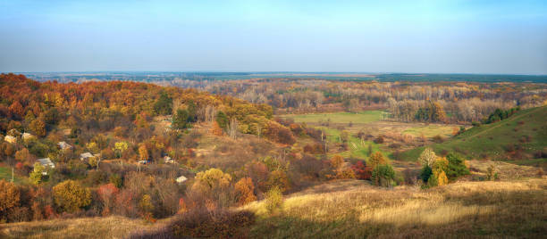 istock Rural autumn landscape with hills on which trees grow 1163297139