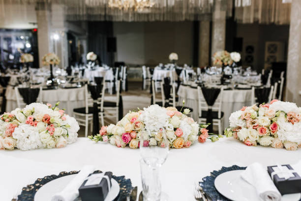 istock Elegant Wedding Reception table decor and centerpieces. Restaurant decor for event with natural roses 1163297812