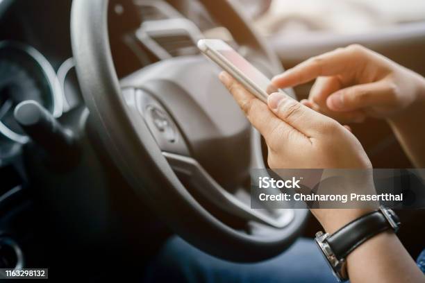 Close Up Driver Woman Hand Holding Smartphone For Using Gps Navigation Of Travel Destination And Swipe For Reading Data On Web Browser Or Texting Message Online For Contact While Parking Journey Lifestyle Concept Stock Photo - Download Image Now
