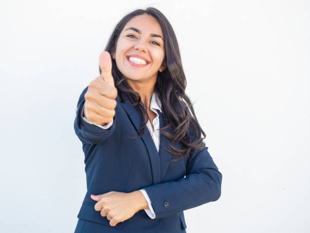 istock Happy successful businesswoman making like gesture 1163300480