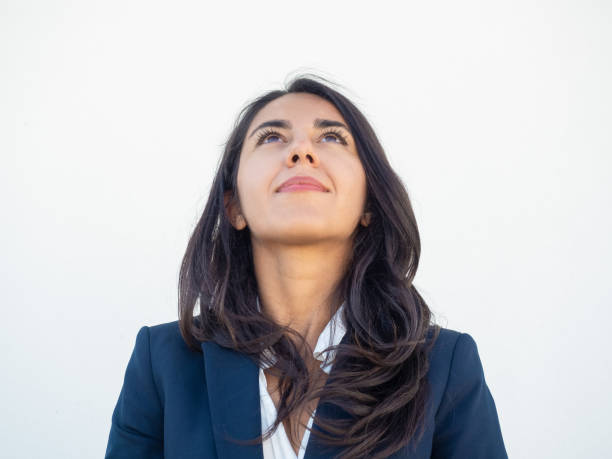 istock Happy young businesswoman studying information above her 1163301273