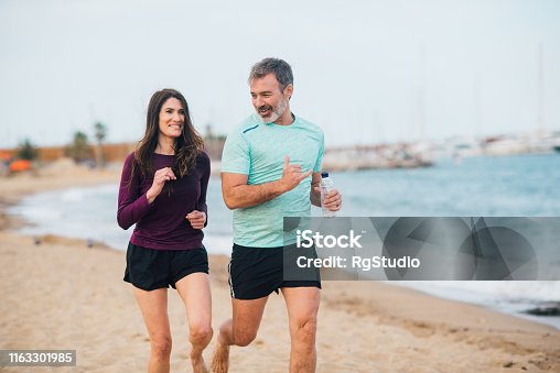 istock Mature couple jogging 1163301985