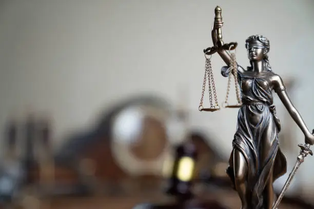 Statue of justice – Themis in the judge office.