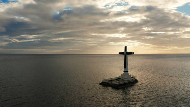 istock Sunken Cemetery cross in Camiguin island, Philippines 1163310122