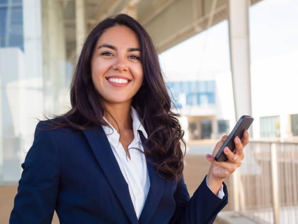 istock Happy successful business professional using cellphone 1163310406