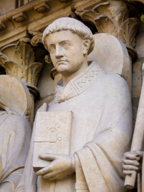 Statue of Saint Stephen at Notre Dame, Paris Medieval Statue of Saint Stephen at the Cathedral of Notre Dame, Paris, France. martyr stock pictures, royalty-free photos & images