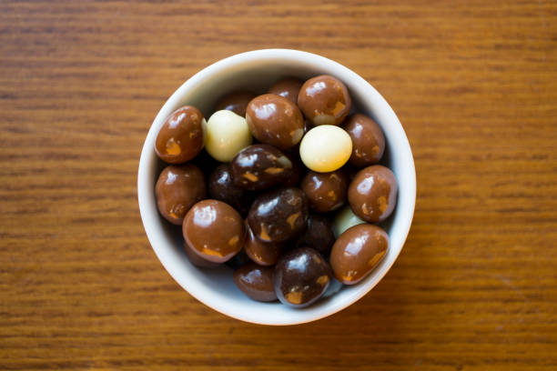 Chocolate Covered Almonds in White porcelain  Bowl