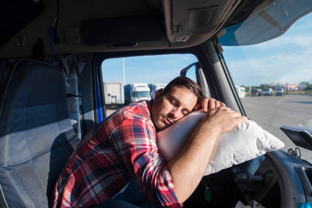 istock Exhausted people sleeping at their job workplace. 1163312730