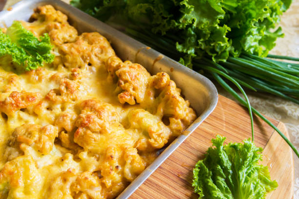 istock Cauliflower in batter under cheese crust on a tray 1163315113