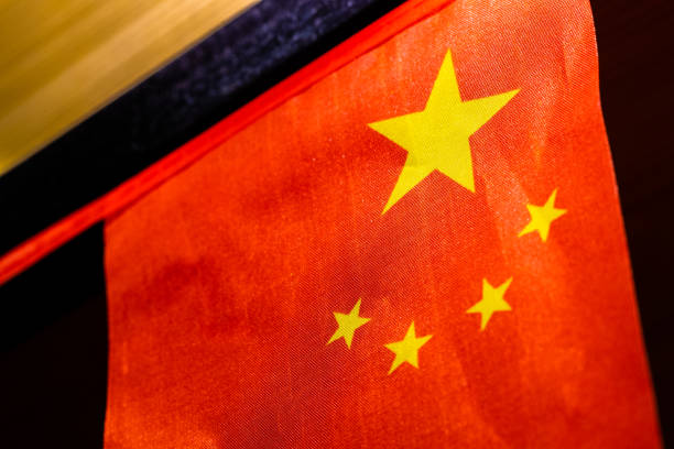 istock Chinese flag hanging in front of wooden boards 1163315519