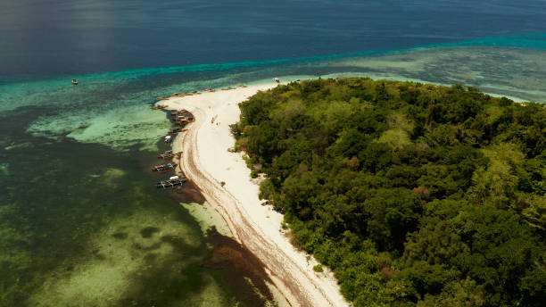 istock Tropical island with sandy beach. Mantigue Island, Philippines 1163316355