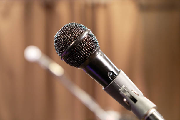 istock microphone to record sound on stage, sing songs 1163316523