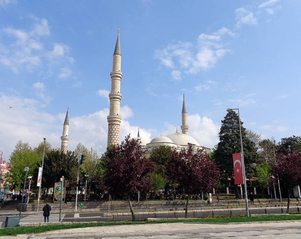 Edirne three Şerefeli Mosque, Uc Serefeli Mosque Edirne, Turkey - April 19, 2019: People pray in mosque called 3 şerefeli cami (Uc Serefeli mosque) Mosque in the center of city of Edirne, East Thrace, Turkey. The Üç Serefeli Mosque, named after its unusual minaret with three balconies (serefe), was built between 1438. unesco organised group stock pictures, royalty-free photos & images