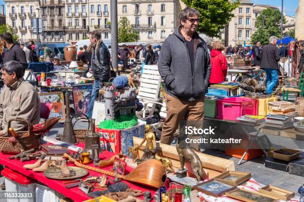 Famous Bordeaux Flea Market Marche Aux Puces In Sunday On Place Near Saint Michel Basilica Aquitaine France Stock Photo - Download Image Now