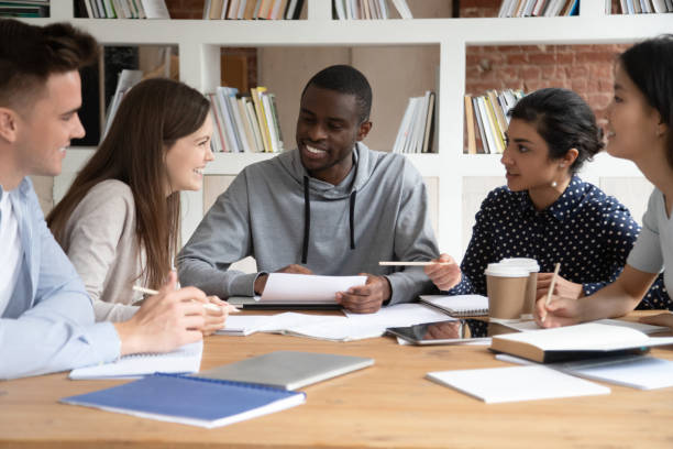istock Happy multiracial young people have fun studying together 1163323427