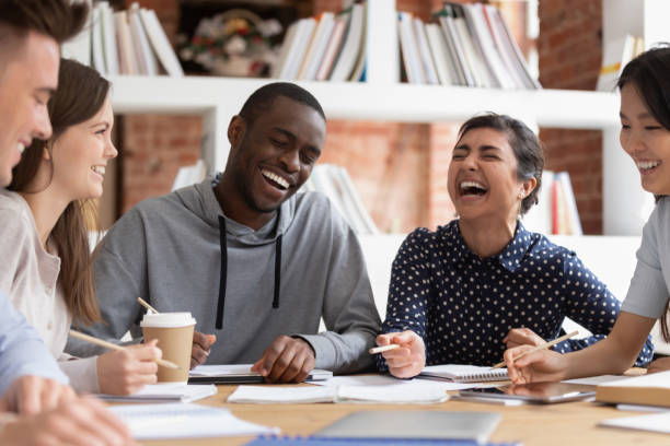 istock Smiling multiracial young people have fun studying together 1163323439