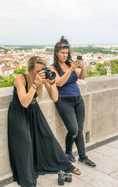 Modle in the city Budapest, Hungary-June 2019. Woman taking a photo in viewpoint of Budapest in a cloudy day. modle stock pictures, royalty-free photos & images