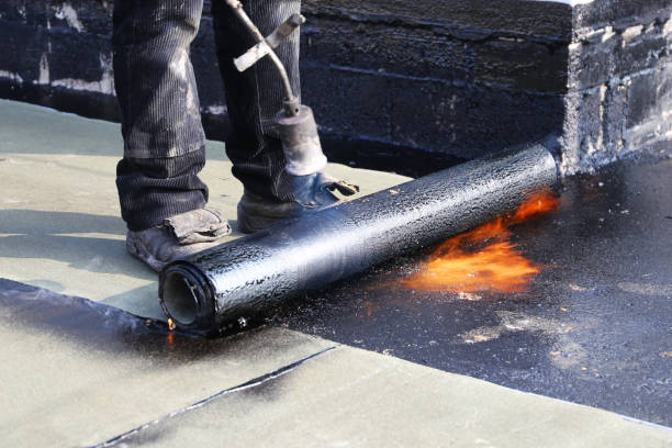 istock Waterproofing flat roof with bitumen sealing membranes 1163325093