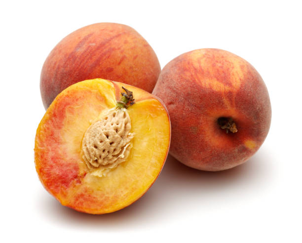 istock Ripe peach fruits isolated on white 1163326870
