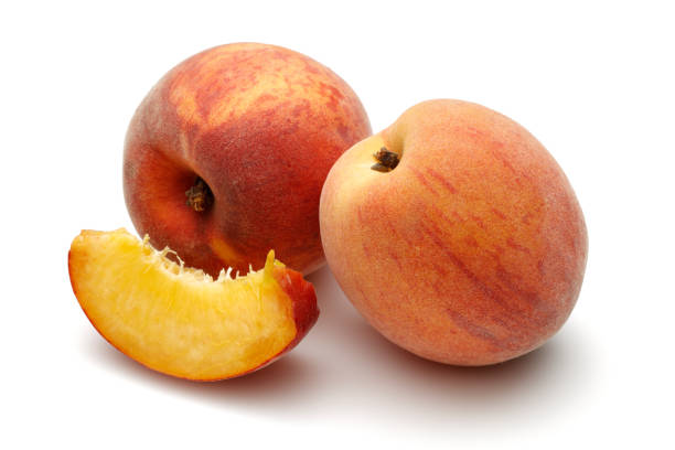 istock Ripe peach fruits isolated on white 1163326907