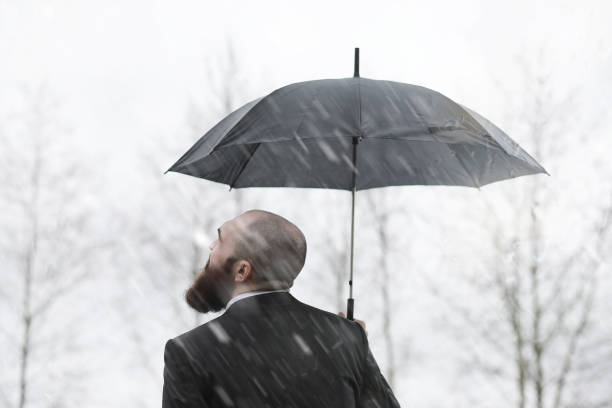 istock A bald bearded man in a suit 1163327403