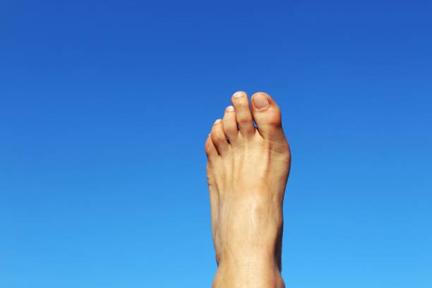 istock A woman's foot stretched into the air 1163328073